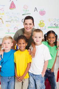 A group of preschool kids and a teacher in classroom